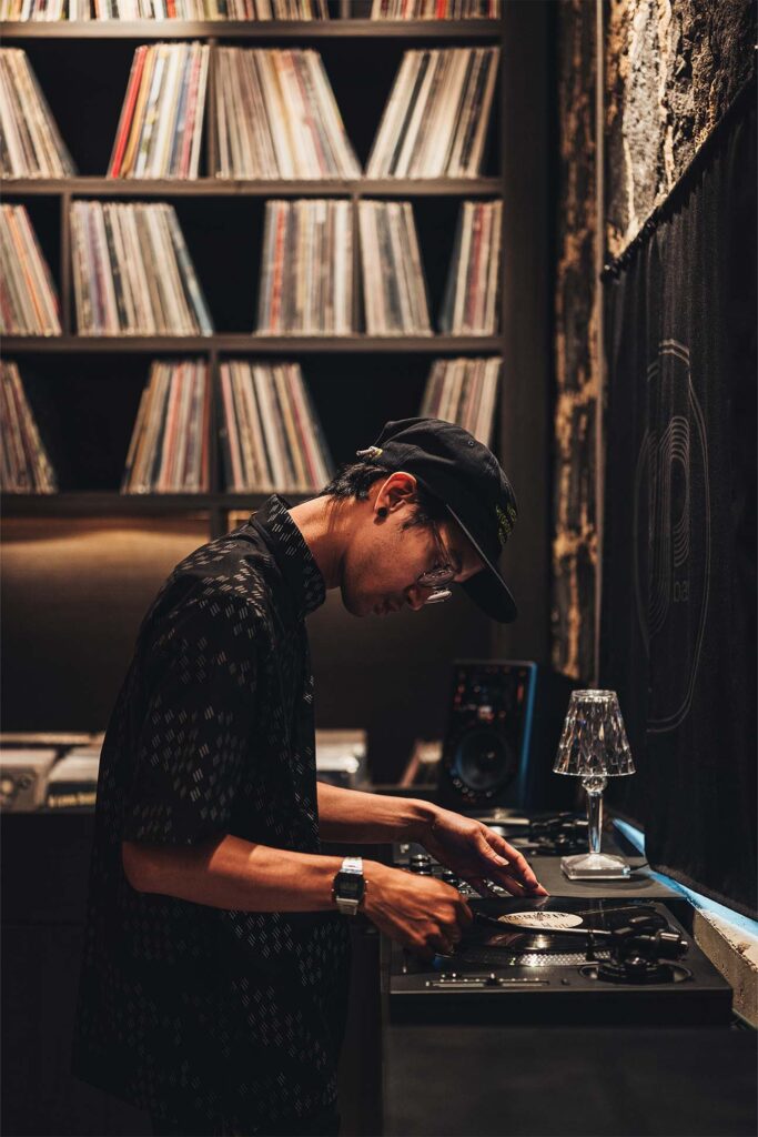 a person playing music on a record player
